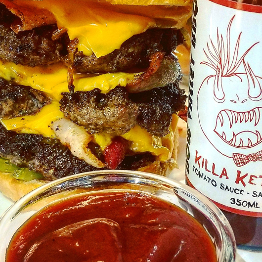 Beef patty burger and bacon with cheese, ketchup and a blend of Kansas City and Carolina mustard sauce - Image